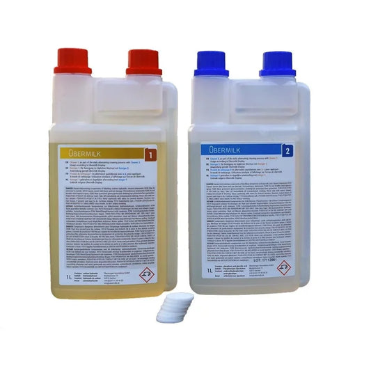 Übermilk Agent 1 and Agent 2 cleaning bottles with a filter disc